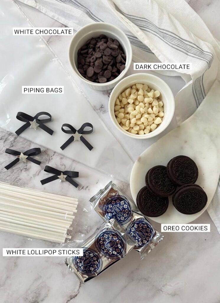 Ingredients and tools for Jack Skellington Oreo Pops laid out on the counter.